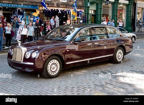Queen Elizabeth Ii S Bentley Car Travelling Down The Royal Mile For An
