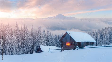 Fantastic Winter Landscape With Wooden House In Snowy Mountains Hight