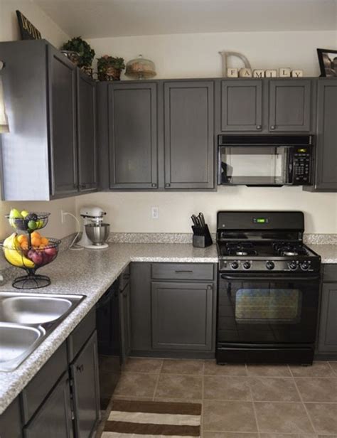 The grey and white cabinets feel fresh and modern while the rich maple keeps the space grounded in a traditional style. Black Appliances and White or Gray Cabinets - How to Make ...