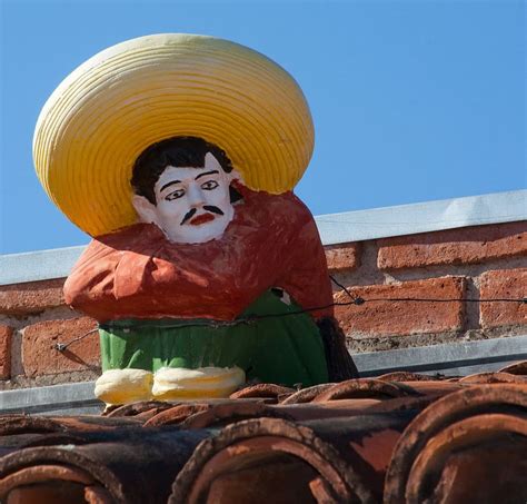 Man Red Long Sleeved Top Statue Sombrero Mexican Arizona Hat