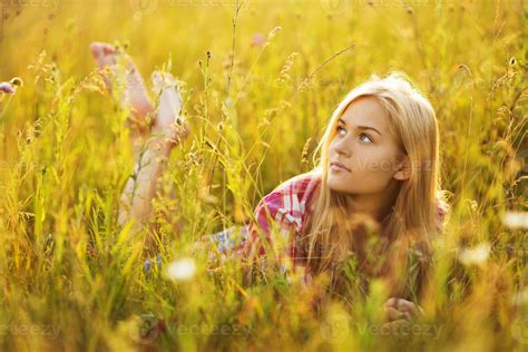 Beautiful Blonde Girl Lying In The Grass 3265544 Stock Photo At Vecteezy