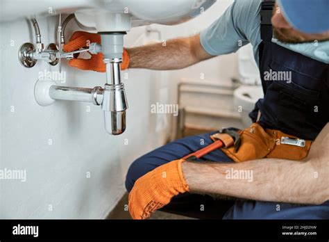 Male Plumber Hands Repairing Pipe Under Sink Stock Photo Alamy