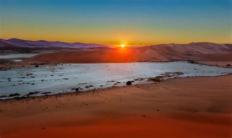 The Sunrise Above Sand Dunes In The Namibian Desert Near Sossusvlei In