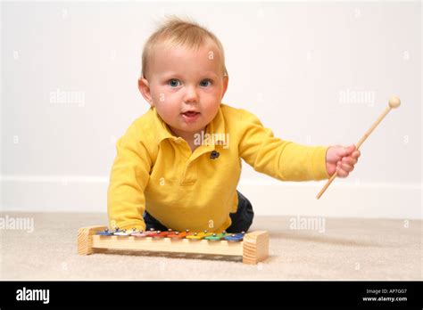 9 Month Old Boy Playing A Xylophone Stock Photo Alamy