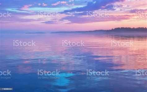 Misty Lilac Sunset Seascape With Sky Reflection Stock Photo Download