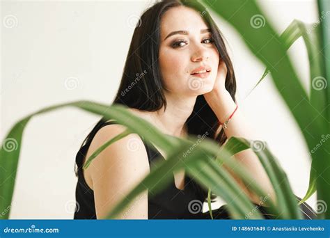 Woman With Greenery On White Background With Copy Space Summer Fashion Photo Skin Care Concept
