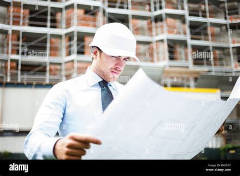 Architect At Work In A Construction Site Stock Photo Alamy