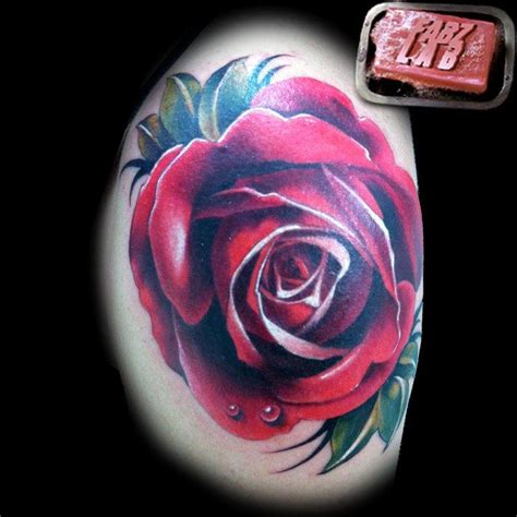 Rose Tattoo With Dew Drops By Fabian Danger De Gaillande Tattoonow