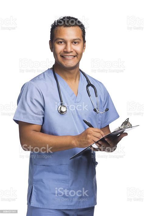 Latin Nurse Holding Clipboard Stock Photo Download Image Now Men