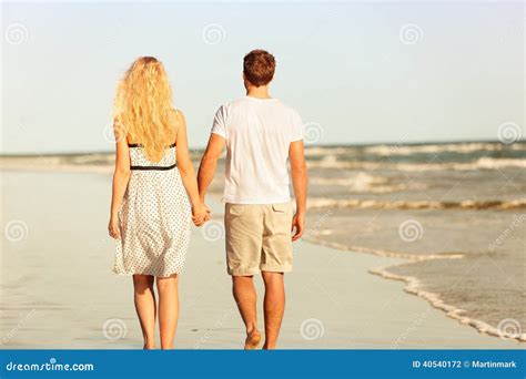 Beach Couple Holding Hands Walking At Sunset Stock Photo Image Of