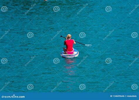 Gmunden Austria August 08 2018 Young Woman On Paddle Board At The