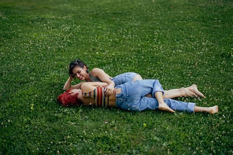 Photo Of Two Lesbian Girls Laying Next To Each Other Talking Being