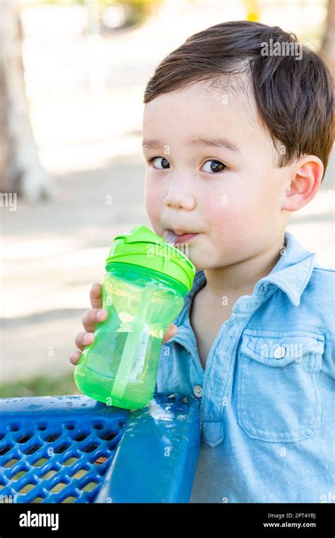 Chinese And Caucasian Boy Drinking Water At Playground Stock Photo Alamy