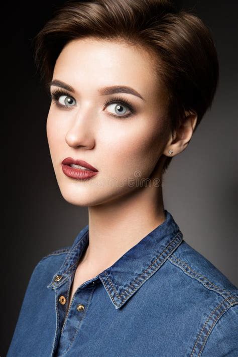 Portrait Of A Beautiful Girl With Short Purple Hair In A Police Uniform