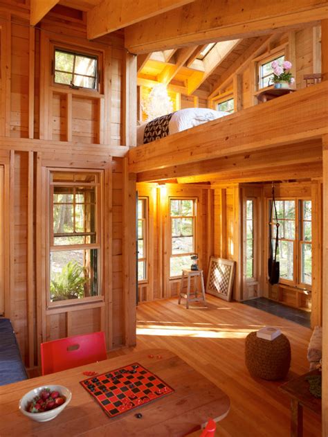 The top part is used as the bedroom while the low part is designed for other rooms like kitchen, dining room, and also a living room. Tiny Houses: Inside and Out - Town & Country Living