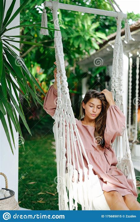 Brunette Relaxing In A Hammock Outside Her Resort House Stock Image Image Of Nature Female