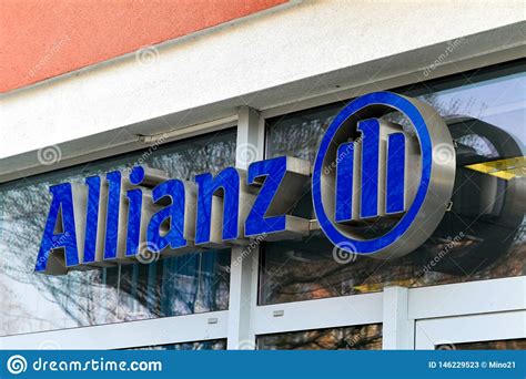 Allianz se is a european multinational financial services company headquartered in munich, germany. Blue Banner Of A German Allianz Insurance Company Above The Entrance Of The Local Branch ...