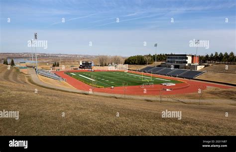 American Sports Complex Of A Football Stadium With A Field Of Artificial Grass Running Track