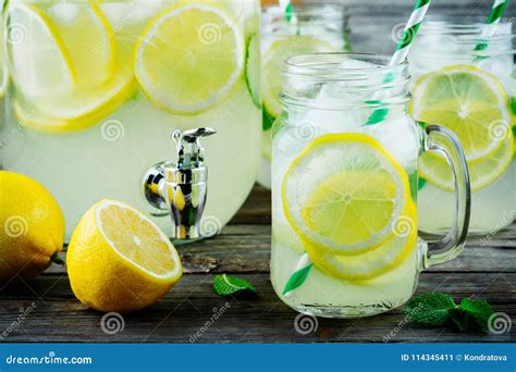 Homemade Lemonade With Mint Ice And Fresh Lemon Slices In Mason Jar