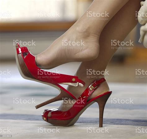 Woman Dangling Her High Heels In A Seductive Manner Stock Photo More