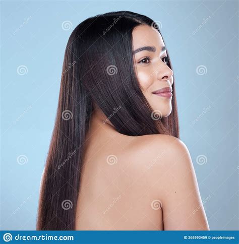 Perfectly Content Studio Shot Of A Beautiful Young Woman Showing Off