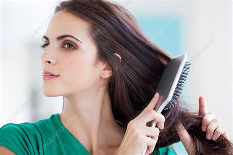 Woman Brushing Her Hair Stock Image C0332217 Science Photo Library