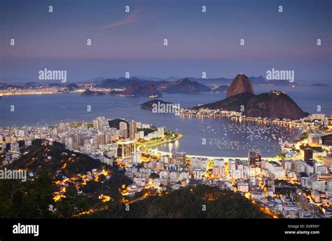 View Of Sugar Loaf Mountain Pao De Acucar And Botafogo Bay At Dusk