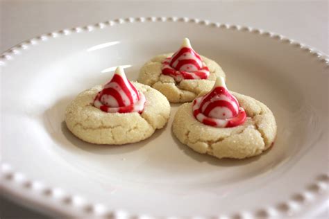Sugar Cookies With A Peppermint Hershey Kiss In The Middle Creating A