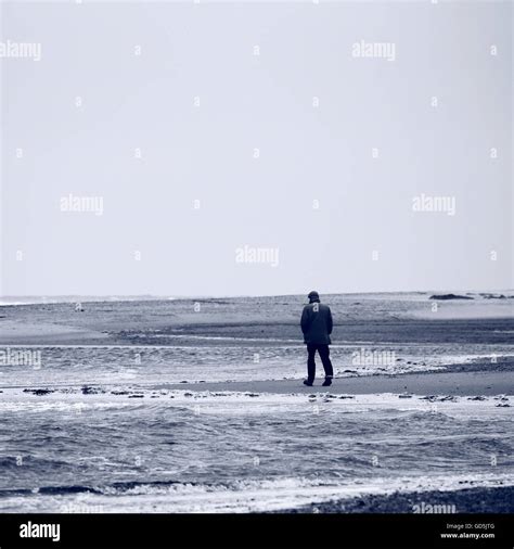 Man Walking Beach Alone Hi Res Stock Photography And Images Alamy
