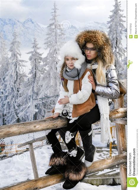 Beautiful Blonde Woman With Baby Mom And Daughter On Snow In Winter