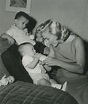 Marilyn with William Metzler and a baby for the Milk Fund, 1957 ...