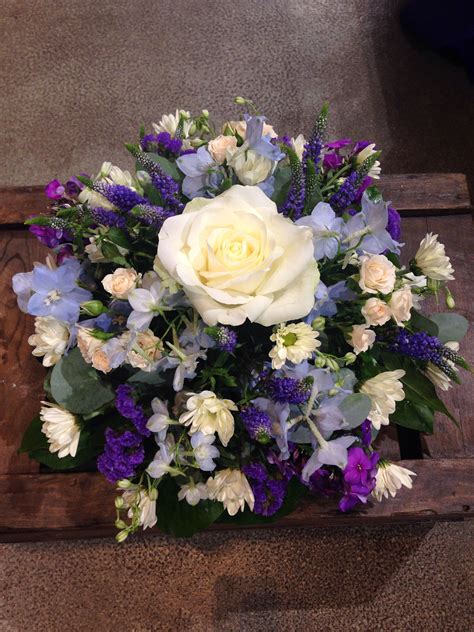 Funeral Posy In Pretty Blues And Creams Including Roses And Delphinium