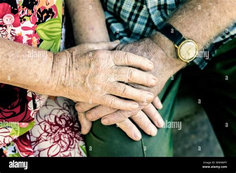 Hands With Wrinkles Of Elderly Couple Holding Hands Of Seniors