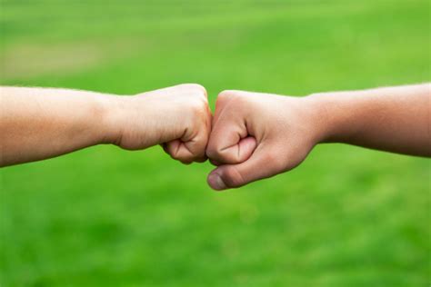 fist bump handshake high five which spreads the most germs cbs news