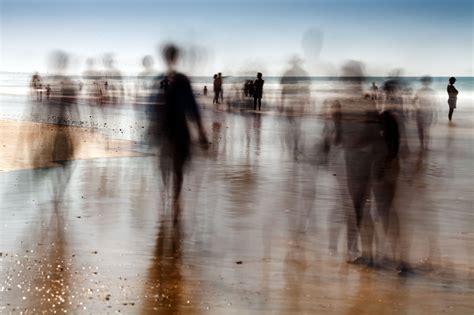 People On The Beach Daylight Long Exposure Shot By The Use Of Neutral