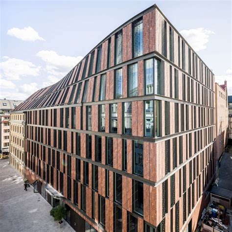 Curving Roof Connects Historic Building With Red Brick Office By 3xn
