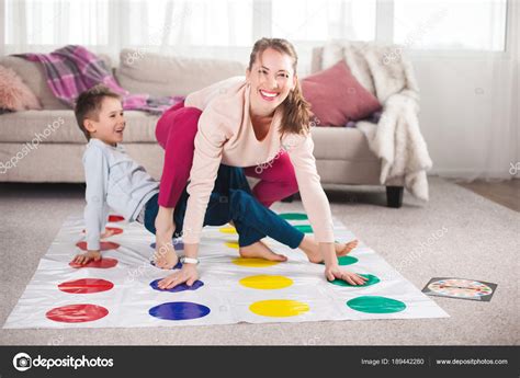 Mother Playing Twister Son Living Room Stock Photo By ©elenachhil 189442280
