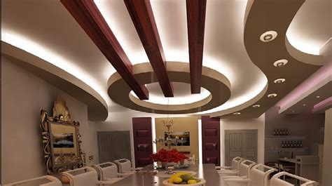 In the centre of the ceiling, a recession is created to hold the two small fans, which almost seem to blend. POP false ceiling designs: Latest 100 living room ceiling ...