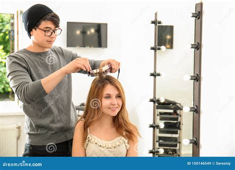 Professional Hairdresser Working With Client In Beauty Salon Stock