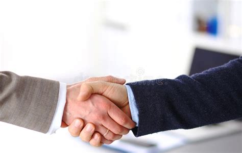 Business Handshake Two Businessman Shaking Hands With Each Other In