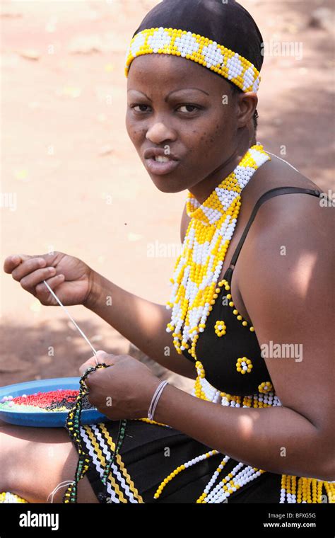 Traditional Beaded Dressed Of A Zulu Young Adult African Girl Doing Beading Kwazulu Natal
