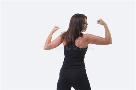 Attractive Middle Aged Woman In Sports Gear Flexing Her Bicep Stock
