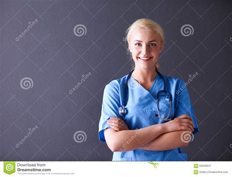 Young Doctor Woman With Stethoscope Isolated On Gray Background Stock