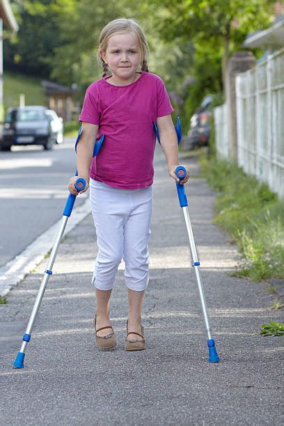 Little Girl With Crutches Stock Photos Pictures And Royalty Free Images