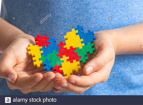 World Autism Awareness Day Concept Child Hands Holding Colorful Puzzle