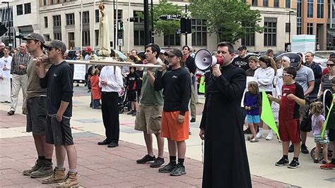 catholics march in protest in madison wi after 50 person limit imposed on masses catholic