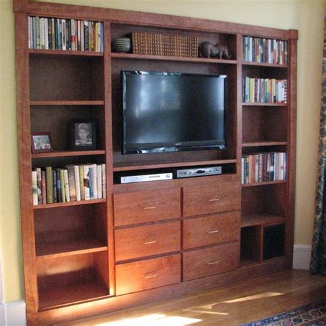What i'm hoping to build is some sort of shelfs that hang just below my plasma tv. Custom Made Entertainment Unit