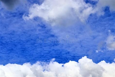 Calm And Beautiful Mixed Fluffy Cloud Formations On A Stunning Deep