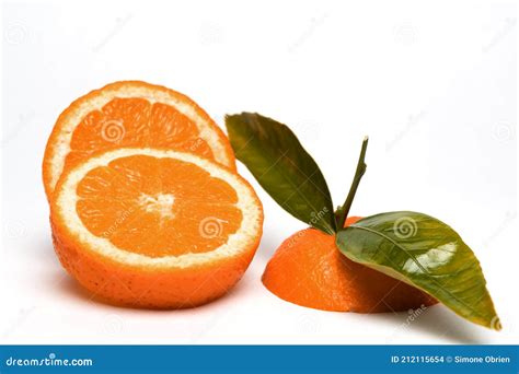 Cut Orange Fruit With Leaves Isolated On White Copy Space Health