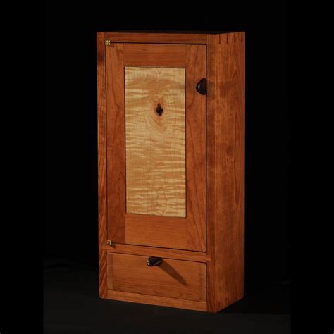 They will typically last the longest and are the most durable in bathrooms if they. Custom Made Cherry/Maple Wall Cabinet by Blackstone Design ...